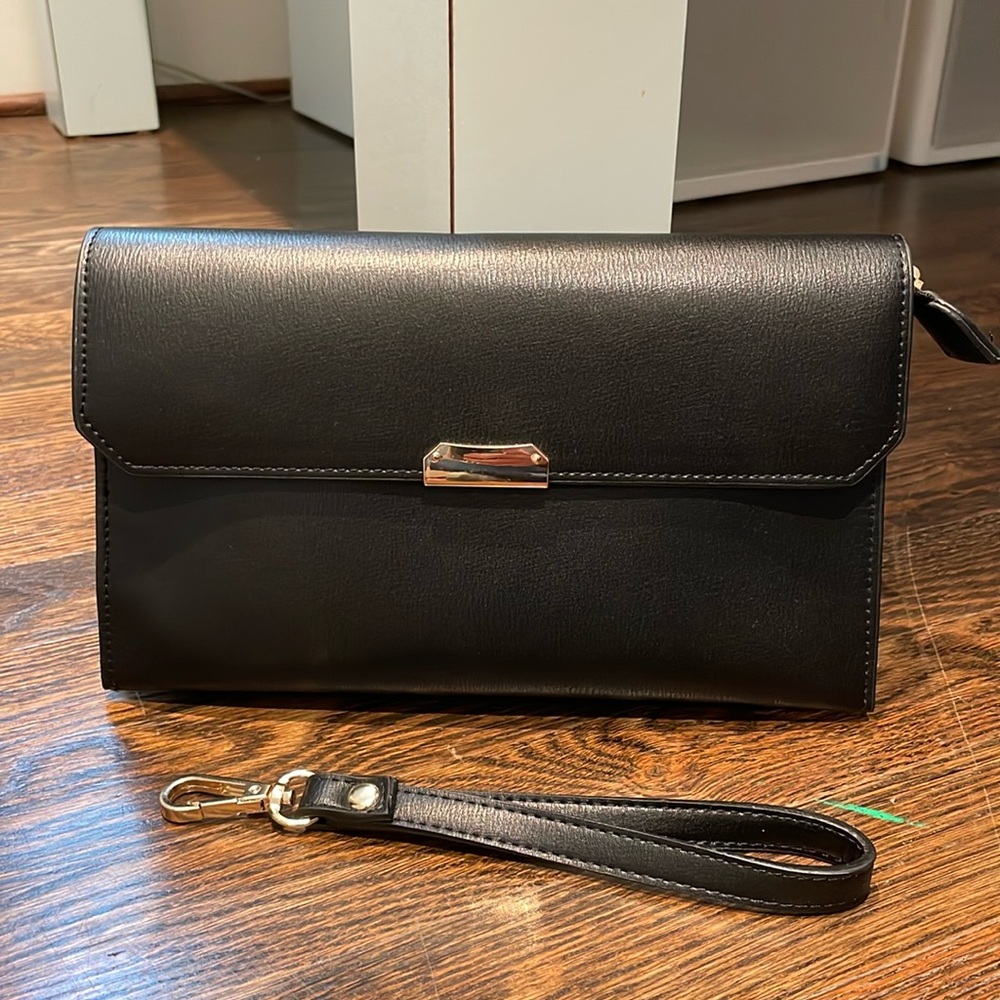 Black leather wristlet clutch with gold accents  from DSW NWOT